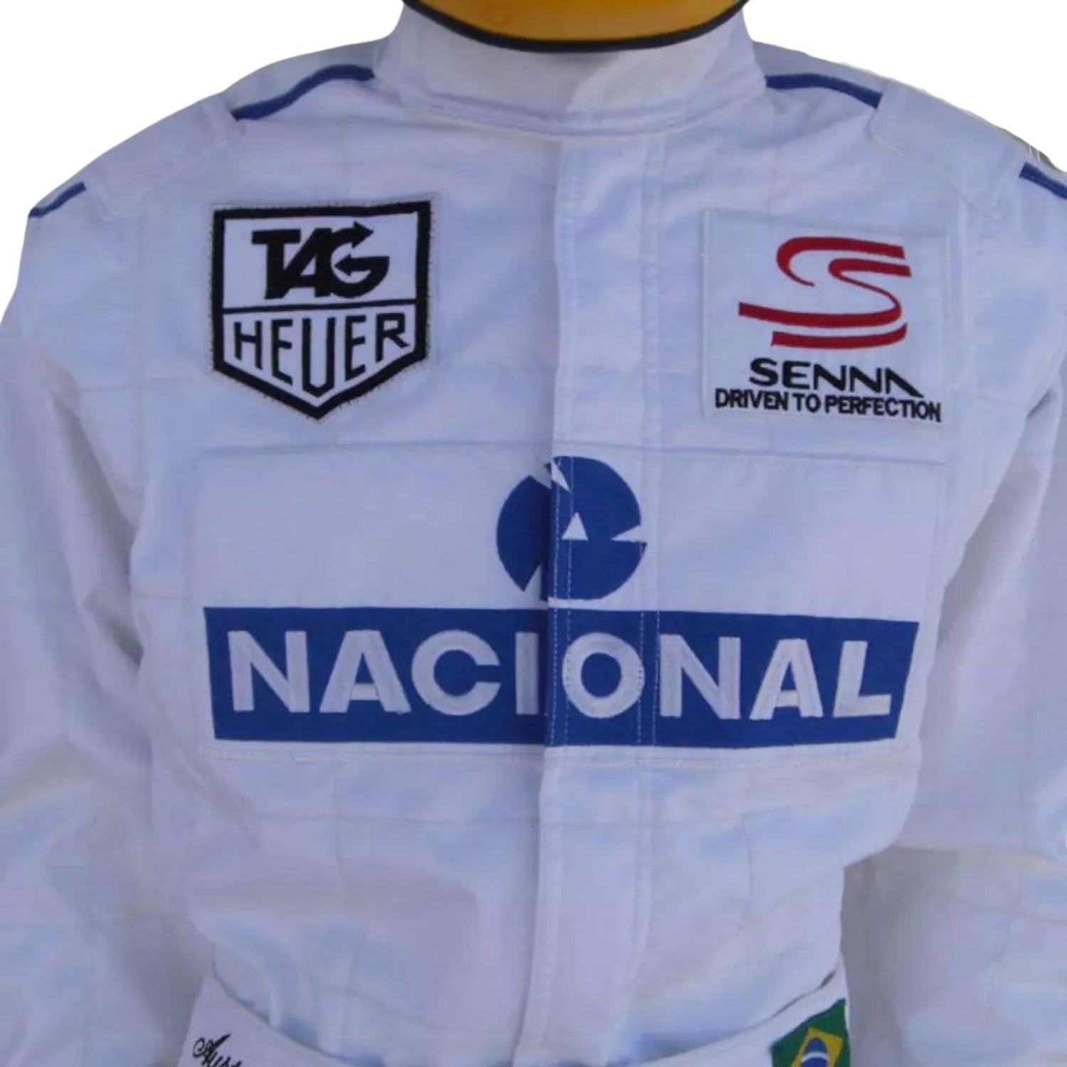 Detailed close-up of the Ayrton Senna name tag and chest sponsor patch, showcasing the vintage embroidery and authentic racing wear marks from the Paris Bercy event.