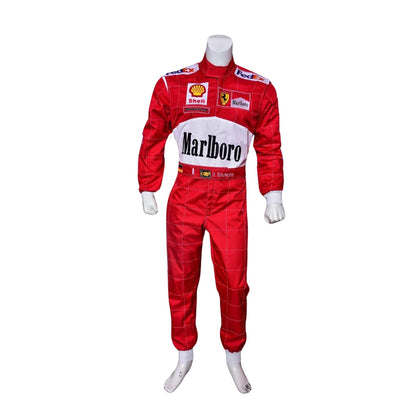 Front view of Michael Schumacher’s 2000 F1 race suit, featuring Ferrari red with white accents and sponsor logos that define his first world championship with the team.