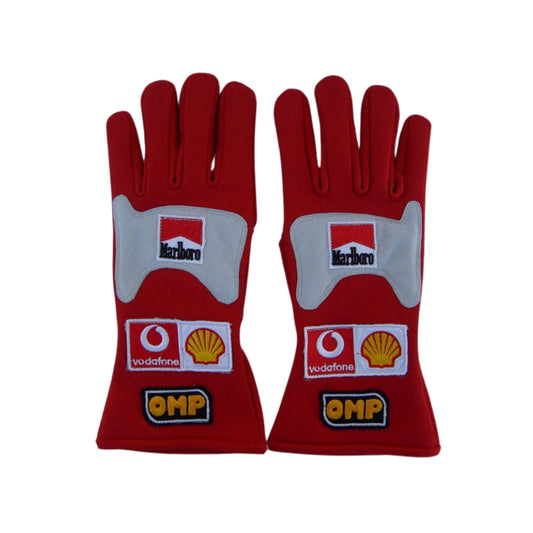 Red Michael Schumacher 2006 F1 Racing gloves with multiple brand logos on a white background