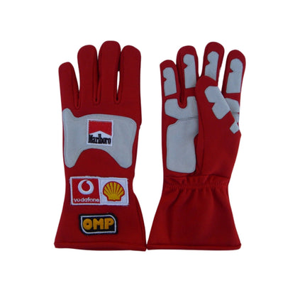 Red Michael Schumacher 2006 F1 Racing gloves with sponsor logos on a white background