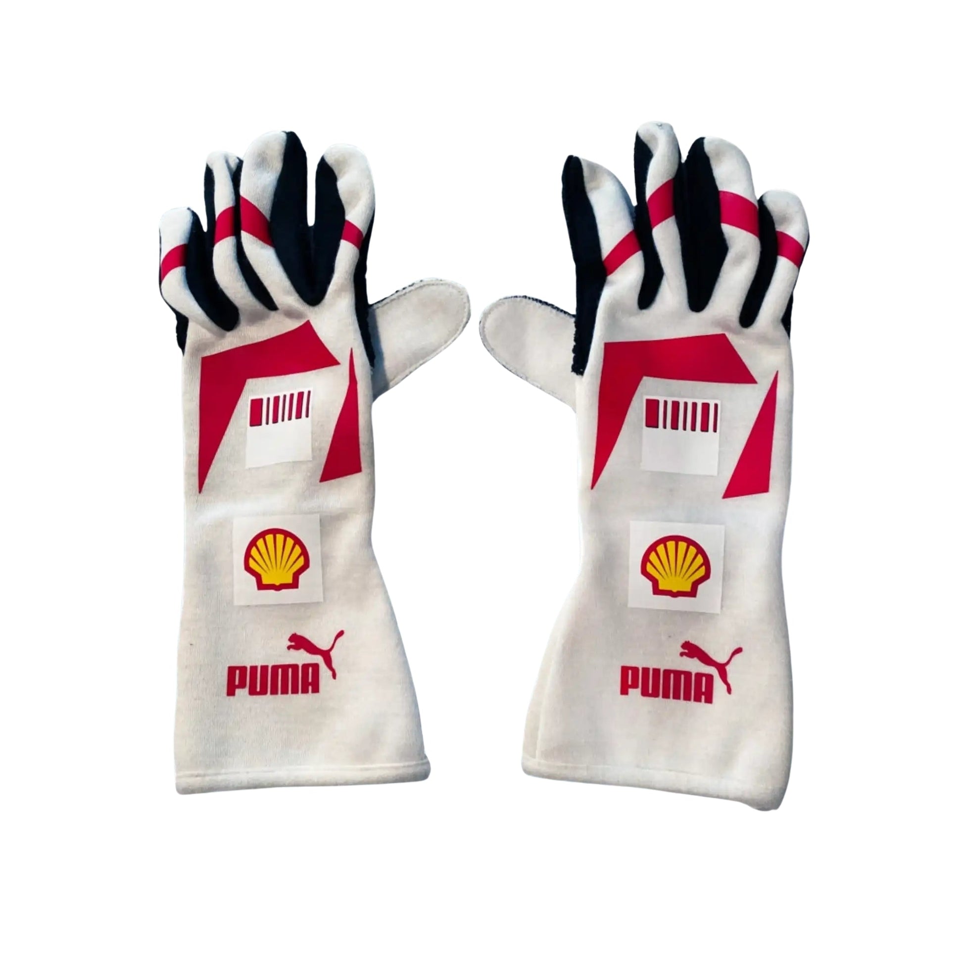 Pair of white Michael Schumacher 2007 F1 racing gloves with red and black accents featuring Puma and Shell logos on a white background.