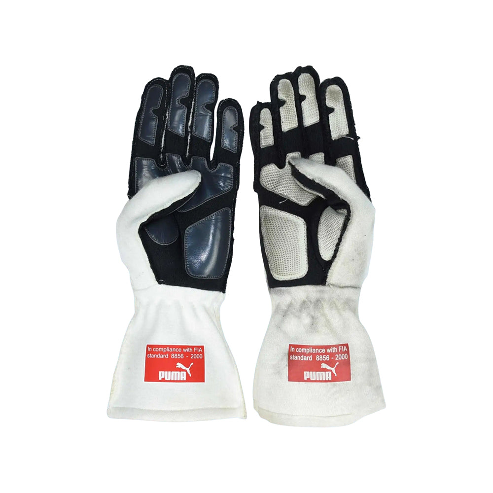Pair of black and white Kimi Raikkonen / Felipe Massa 2008 F1 Racing gloves with Puma branding on a white background