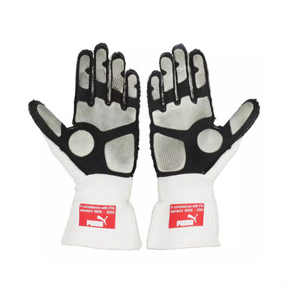 Pair of white and black Fernando Alonso 2010 Japanese GP F1 racing gloves with Puma branding on a white background