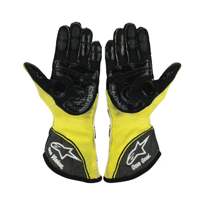 Pair of black and yellow Nico Rosberg 2011 F1 racing gloves with a brand logo on a white background