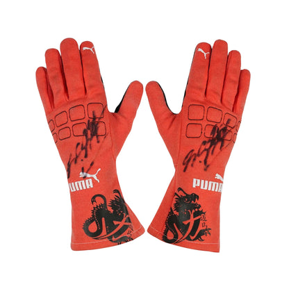 Red Michael Schumacher 2012 F1 Racing gloves with black designs and Puma logo on a white background