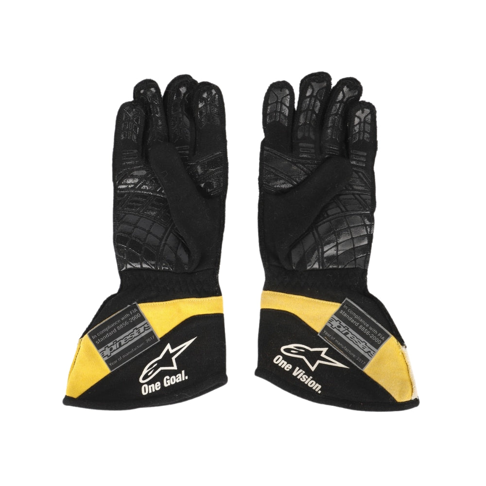Black and yellow Carlos Sainz 2017 F1 racing gloves with branding on a white background
