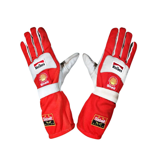 Red and white Helio Castroneves 2017 IndyCar racing gloves with Shell and Sabelt logos on a white background