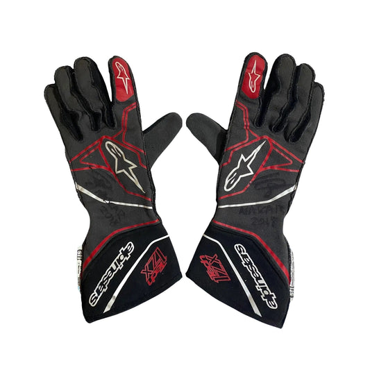 Black and red Conor Daly 2018 NASCAR racing gloves with visible branding on a white background