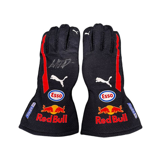 Pair of black Max Verstappen 2018 F1 racing gloves with Red Bull and Esso branding on a white background