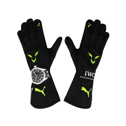 Black Lewis Hamilton 2022 F1 Racing gloves with green accents and a watch on a white background