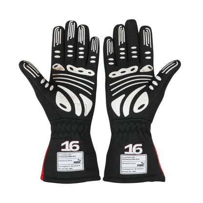 Pair of black Charles Leclerc 2023 F1 racing gloves with white accents and '16' branding on a white background