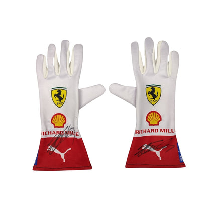 Pair of white Charles Leclerc 2023 Monaco GP F1 Racing gloves with Ferrari and Shell logos on a white background