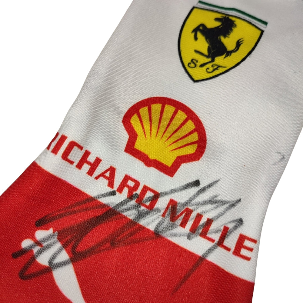 Close-up of a Charles Leclerc 2023 Monaco GP F1 Racing Gloves fabric with Ferrari, Shell, and Richard Mille logos.