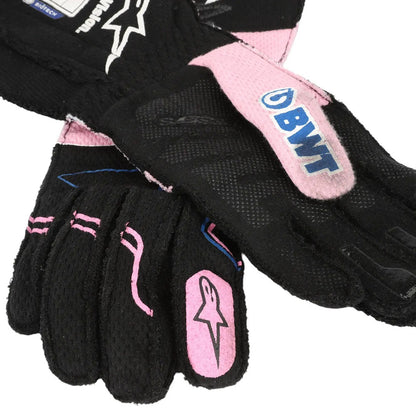 Black and pink Esteban Ocon 2023 Miami GP F1 Racing gloves with visible branding on a white background