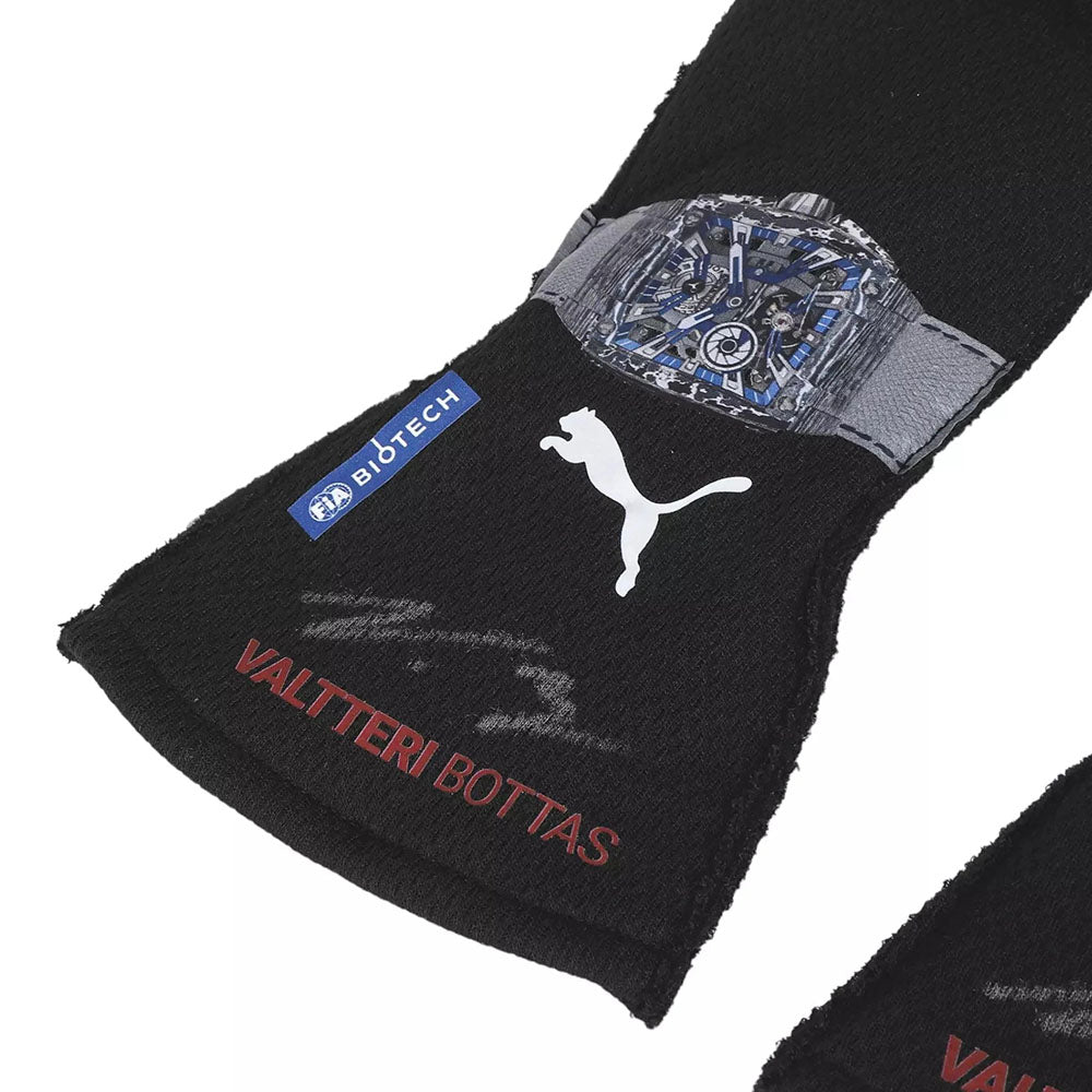 Black Valtteri Bottas 2023 F1 racing gloves wristband with Puma logo and 'Valtteri Bottas' text on a white background