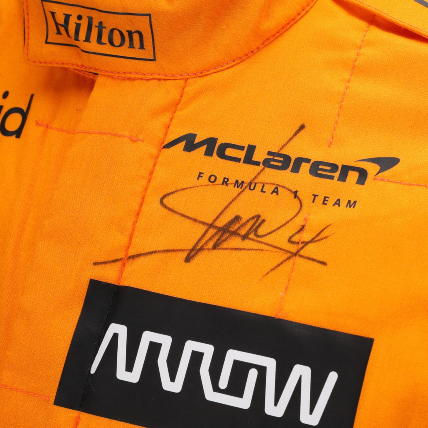 Close-up of Lando Norris's 2024 Formula 1 racing suit signature