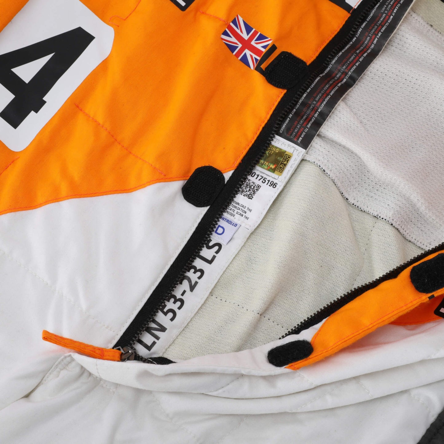 Close-up of Lando Norris's 2024 Formula 1 racing suit zip material, illustrating the high-quality fabric texture