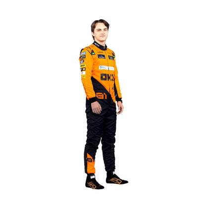 The Left side profile of Piastri's 2024 McLaren F1 racing suit, emphasizing the sharp lines and ergonomic fit, with sponsor placements on the arms and legs to ensure both visibility and flexibility during high-speed racing.