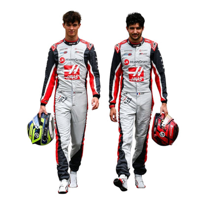 Two individuals in racing suits with visible branding on a white background