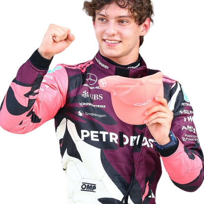 Close-up of high-performance fabric, stitched driver names, and sponsor logos on the 2025 Miami GP racing suits of Andrea Kimi Antonelli.