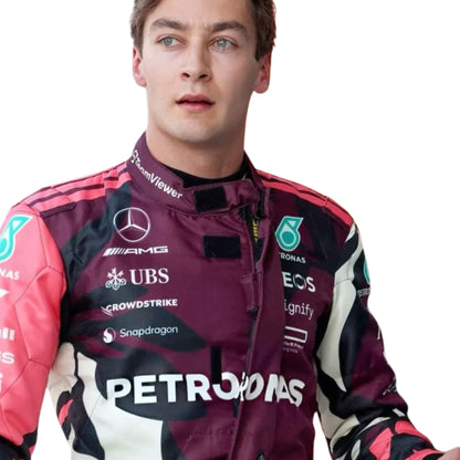 Close-up of high-performance fabric, stitched driver names, and sponsor logos on the 2025 Miami GP racing suits of George Russell.