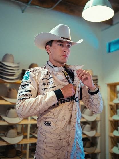 Close-up of stitching, This suit is inspired by the Mojave Desert, and detailing on George Russell 2025 USA Austin GP racing suit