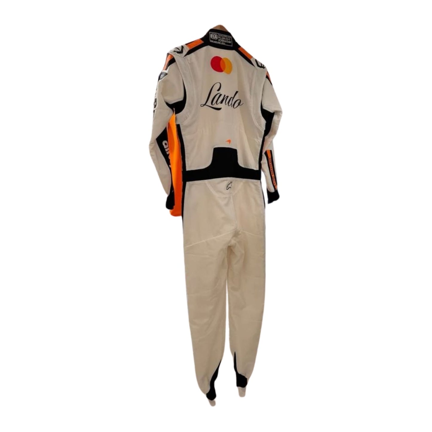 Rear view of the Monaco GP 2025 white race suit worn by Norris showcasing plain white tailored design, driver name badges, and subtle sponsor patches.