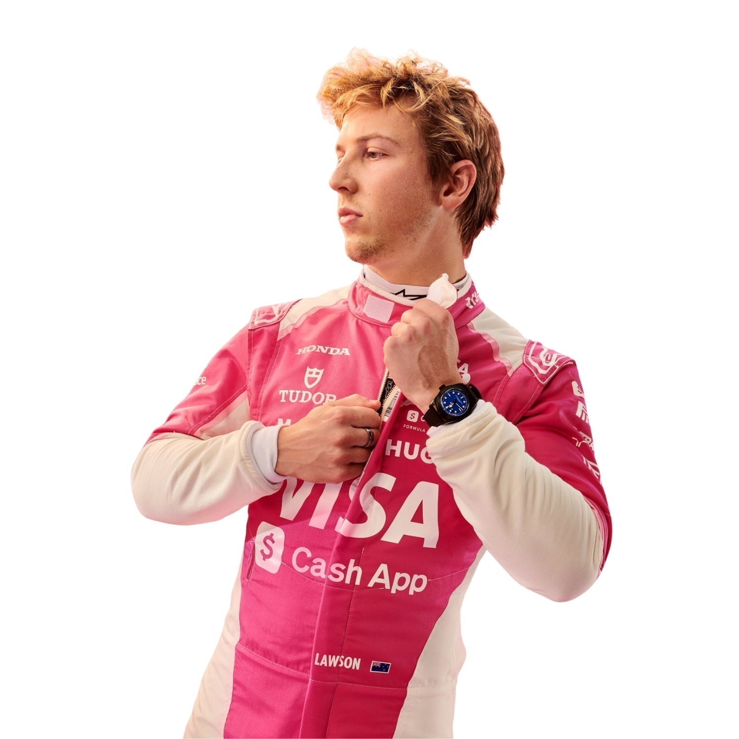 Liam Lawson wearing a pink F1 racing suit with various sponsor logos on a white background