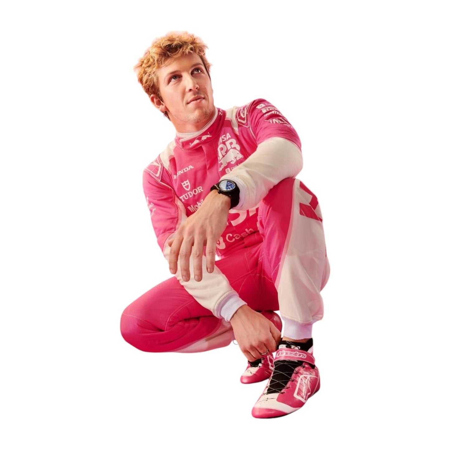 Liam Lawson wearing a pink racing suit with visible branding on a white background