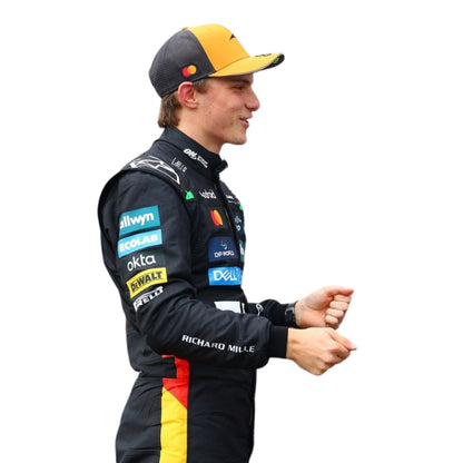 Oscar Piastri 2025 British GP F1 costume side profile showing sharp aerodynamic lines, wearing a racing suit with various sponsor logos on a white background