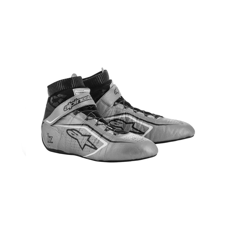 Gray and black Alpinestars Tech1-Zv2 racing shoes with brand logo on a white background