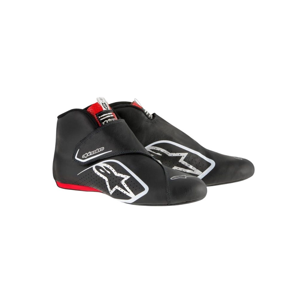 Black Carlos Sainz 2017 F1 racing shoes with visible branding on a white background