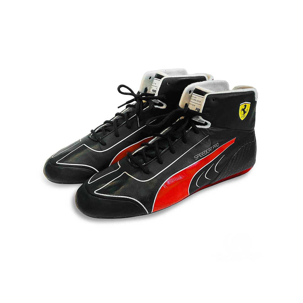 Black and red Charles Leclerc 2022 F1 Racing shoes with a Ferrari logo on a white background