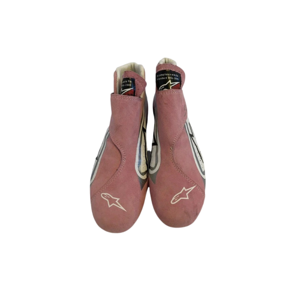 Pair of red Esteban Ocon 2018 F1 Racing shoes with a logo on a white background