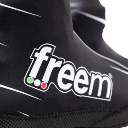 Close-up of a black Freem Yeti shoe cover with 'freem' branding on a white background