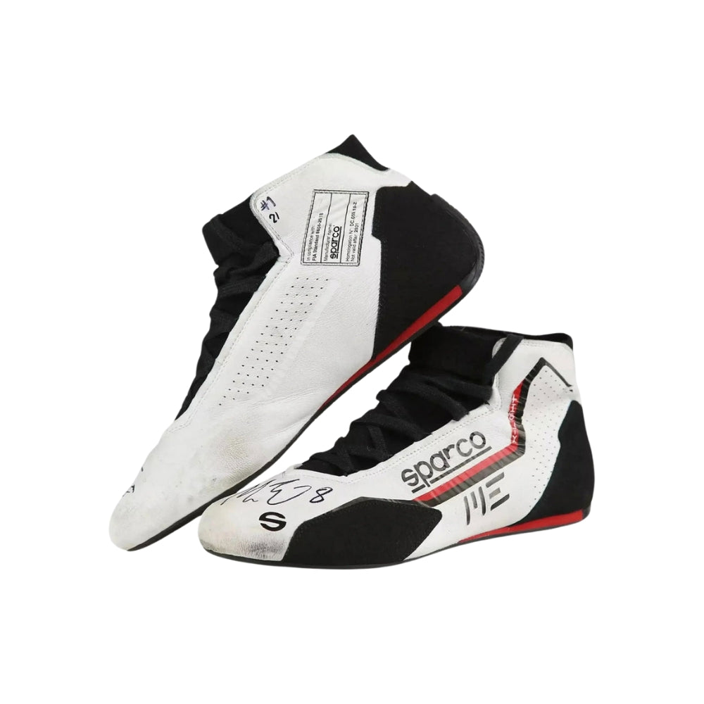 Pair of black and white Marcus Ericsson 2021 Indy 500 Racing shoes with visible branding on a white background