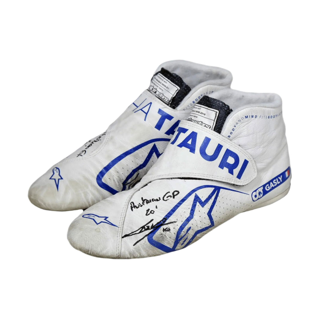 Pair of white Pierre Gasly 2020 Austrian Grand Prix F1 Racing shoes with blue branding on a white background