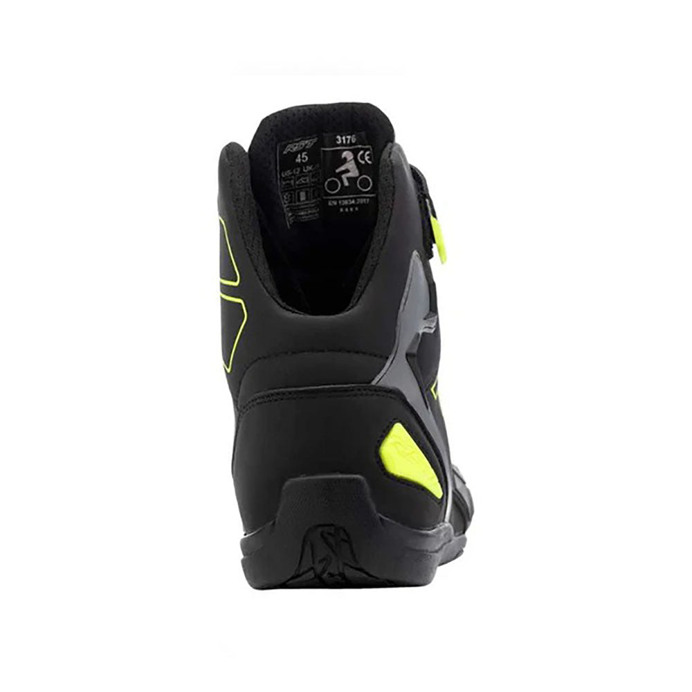 Black and yellow Sabre Moto Racing motorcycle boot on a white background