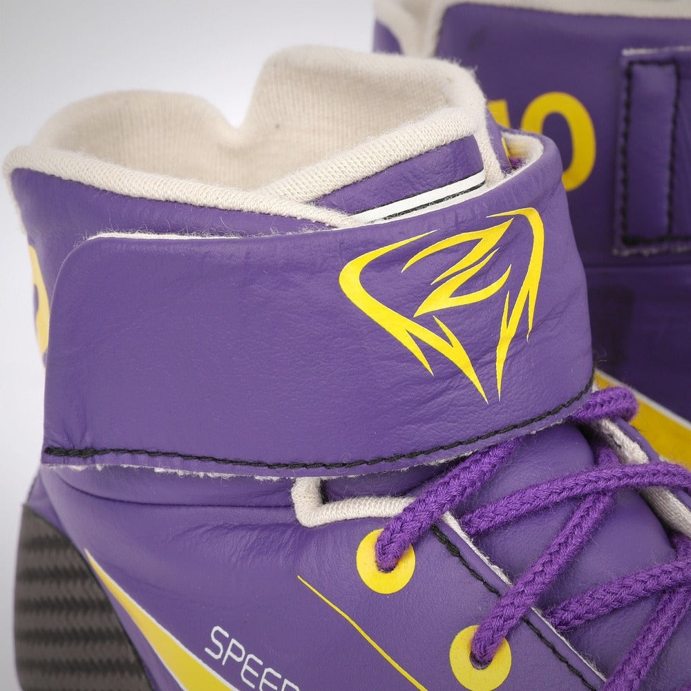 Close-up of purple Zhou Guanyu 2023 Mexico City GP F1 Racing shoes with yellow accents on a white background