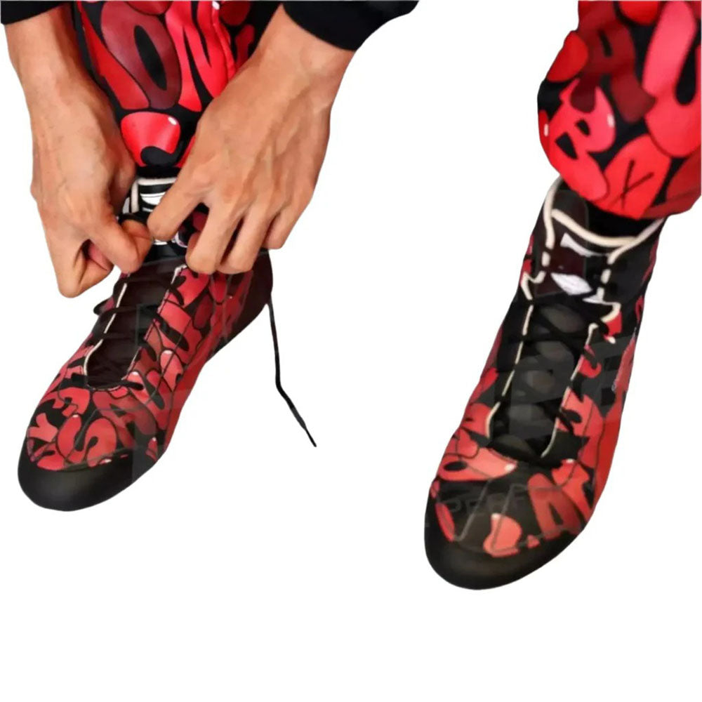 Red and black patterned Zhou Guanyu 2023 Special Edition F1 Racing shoes are being worn on a white background